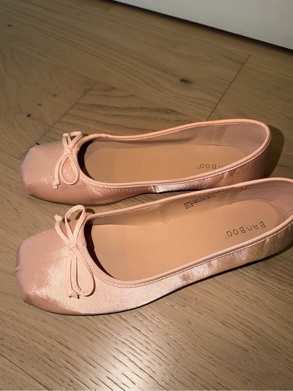 Pink satin ballet flats with bow